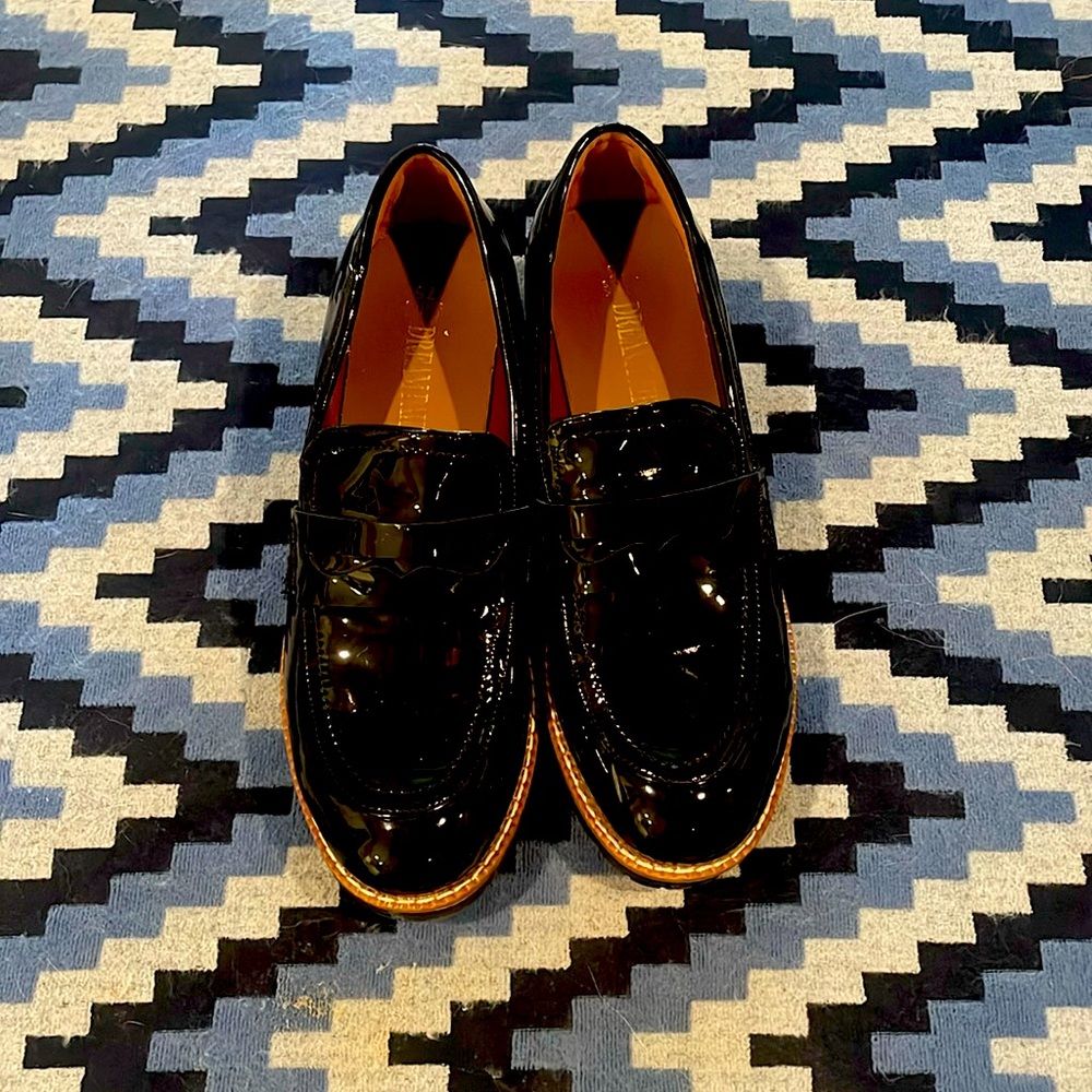 Black patent lug sole loafers